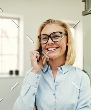 demo-attachment-57-businesswoman-smiling-and-talking-on-her-4C3HEDM